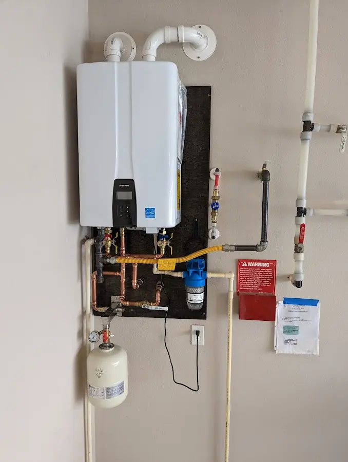 Professional plumber installing copper piping in a Grand Prairie home